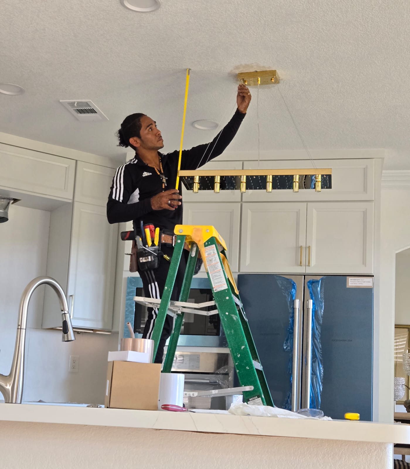 Omar Merino, owner of Diley S. Merino Electric, on the job in San Diego